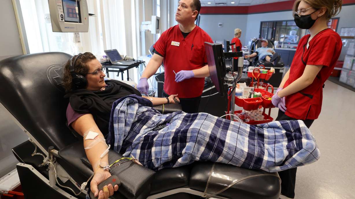 Phlebotomists Paul Darlington and Sariah Kenney set up Becky Watkins to donate platelets and plasma at the American Red Cross Blood Donation Center and Lab in Murray on Aug. 15, 2024.
