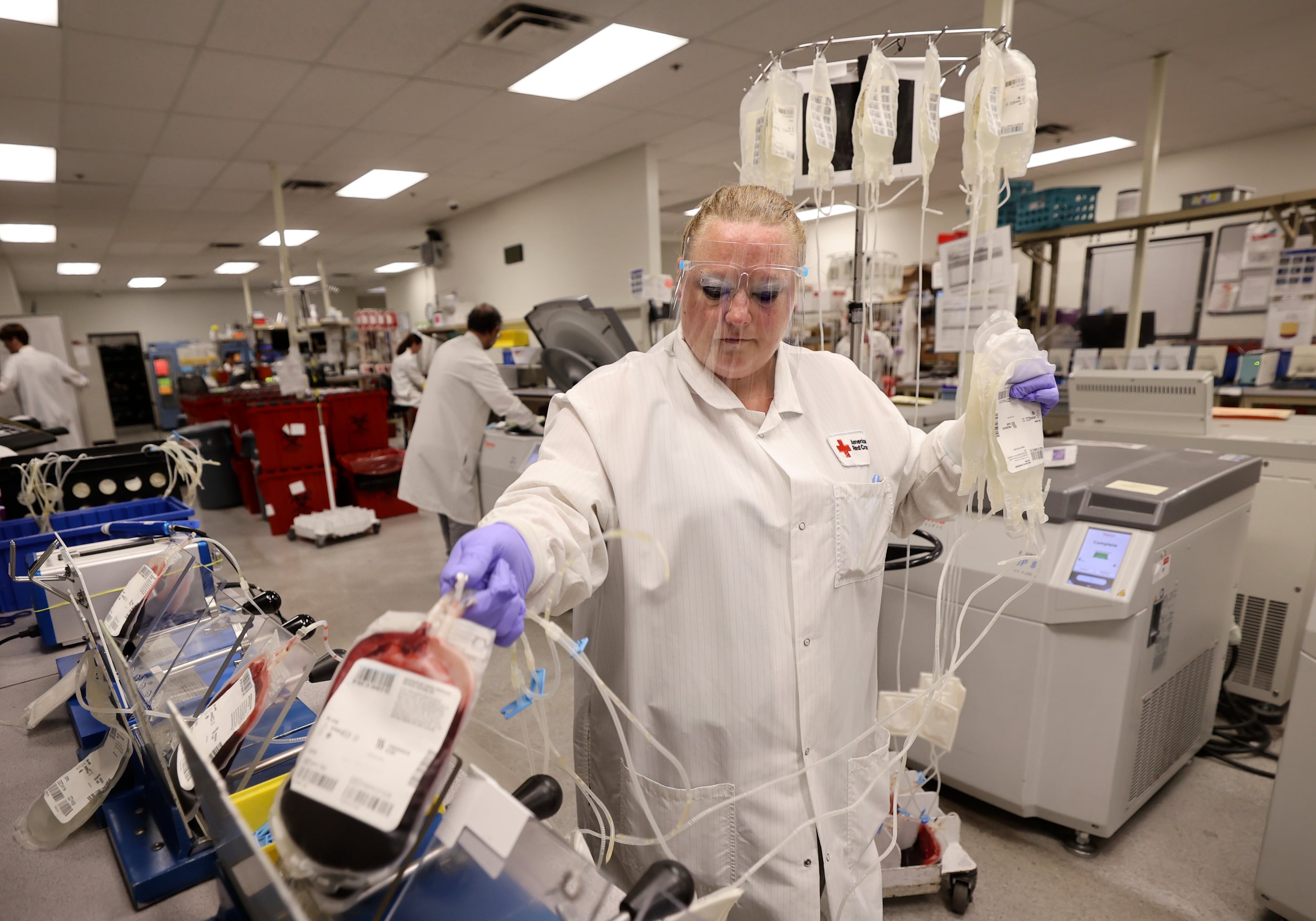 Melissa Turner, blood manufacturing tech lead, processes blood at the American Red Cross Blood Donation Center and Lab in Murray on Aug. 15, 2024.