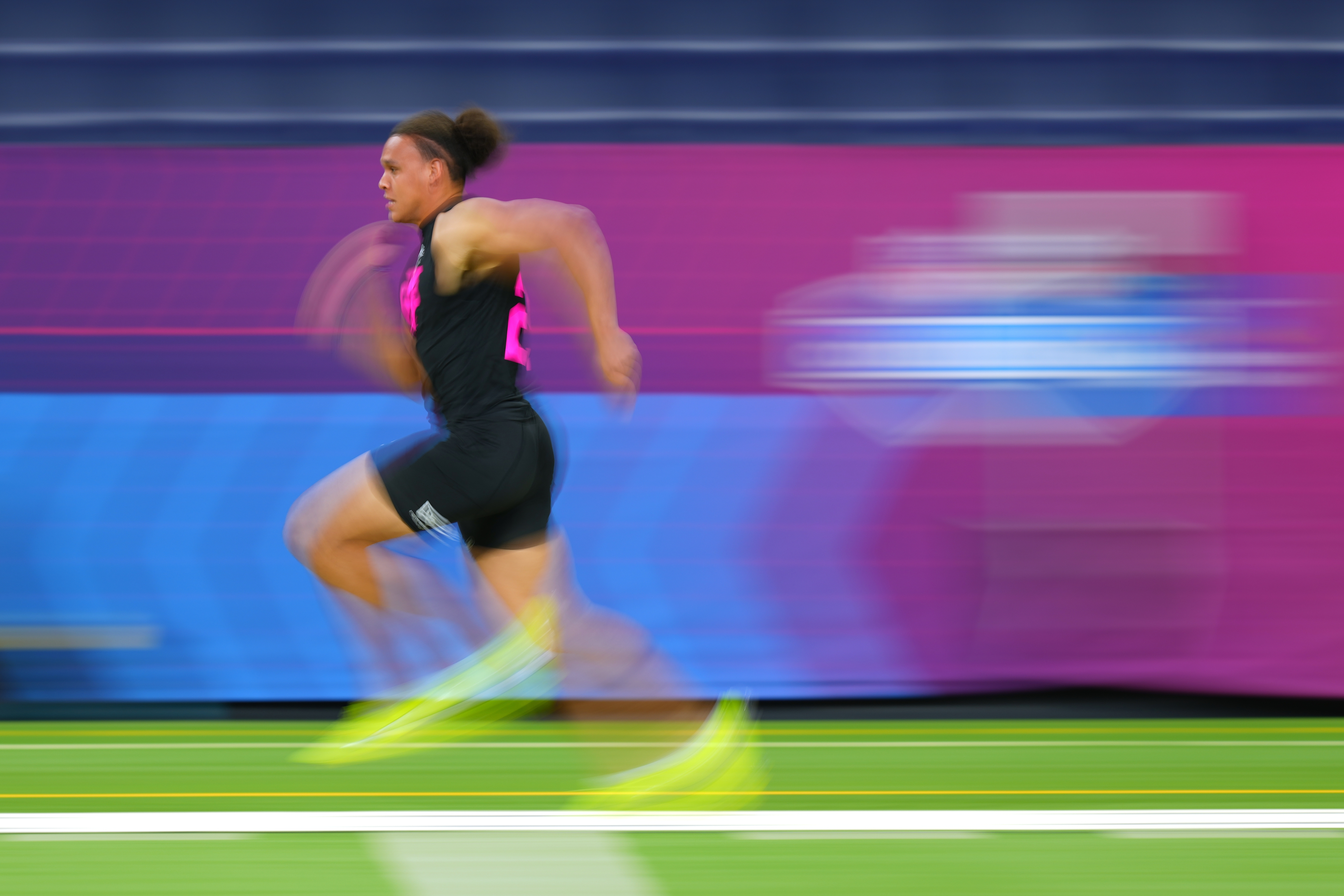 In this photograph taken with a slow shutter speed, Vanderbilt tight end Eli Stowers (25) runs the 40-yard dash at the NFL football scouting combine in Indianapolis, Friday, Feb. 27, 2026.