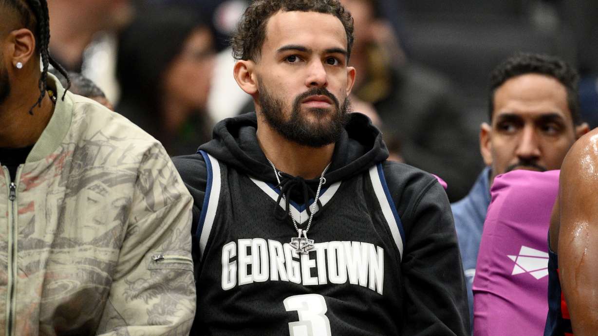 FILE - Washington Wizards guard Trae Young, center, looks on from the bench during the first half of an NBA basketball game against the Los Angeles Clippers, Jan. 19, 2026, in Washington.