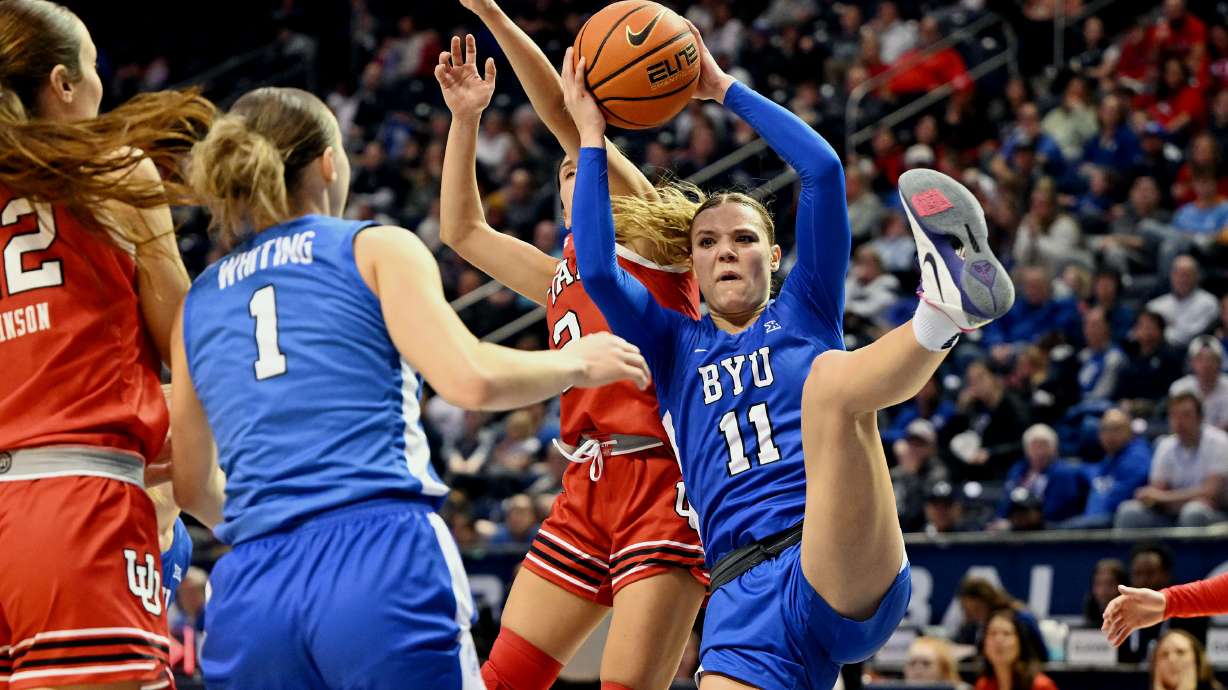 BYU guard Delaney Gibb (11) battles for a rebound with Utah guard Ines Vieira (2) behind her as BYU and Utah women play at the Marriott Center in Provo on Saturday January 25, 2025.