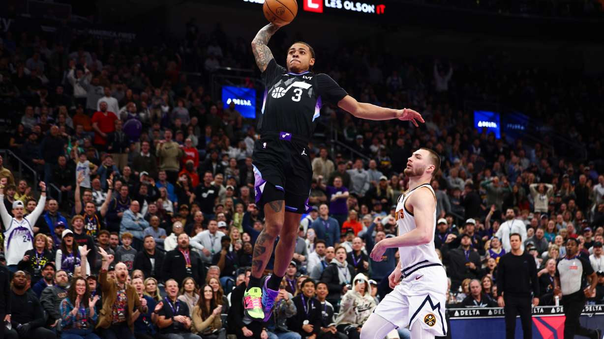 Utah Jazz guard Keyonte George (3) dunks over Denver Nuggets guard Christian Braun (0) during the second half of the game at the Delta Center in Salt Lake City on Monday, March 2, 2026.