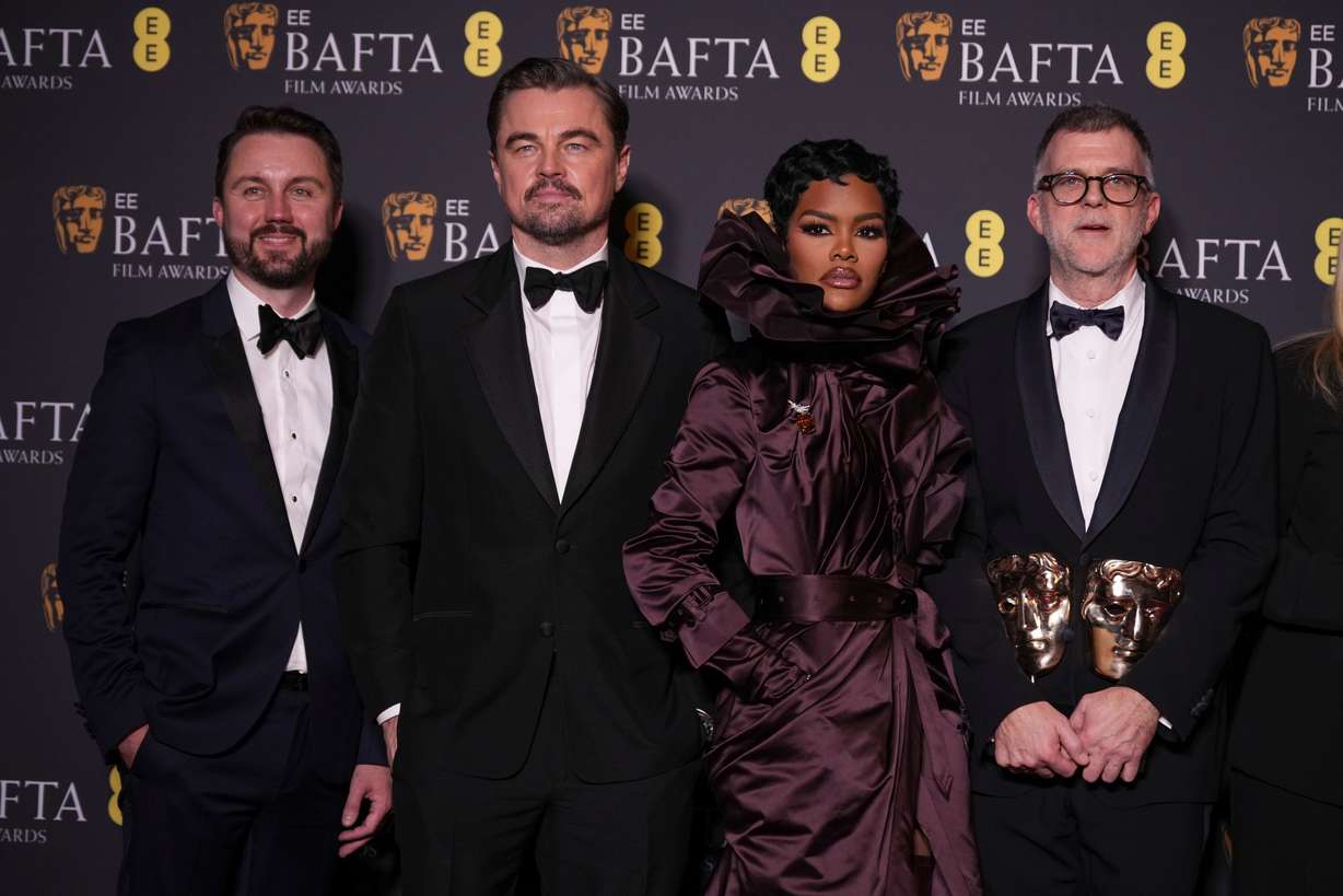Andy Jurgensen, Leonardo DiCaprio, Teyana Taylor, and Paul Thomas Anderson pose with the awards for best director, cinematography, and adapted screenplay for "One Battle After Another" at the 79th British Academy Film Awards, BAFTA's, in London, Feb. 22. The Oscar for best picture is coming down to the wire between the film and "Sinners."