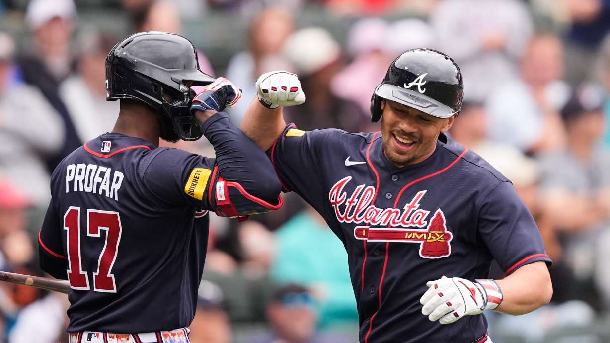 Atlanta Braves Drake Baldwin is greeted by Jurickson Profar after hitting a solo home run in the third inning of a spring training baseball game against the Minnesota Twins in North Port, Fla., Sunday, Feb. 22, 2026.