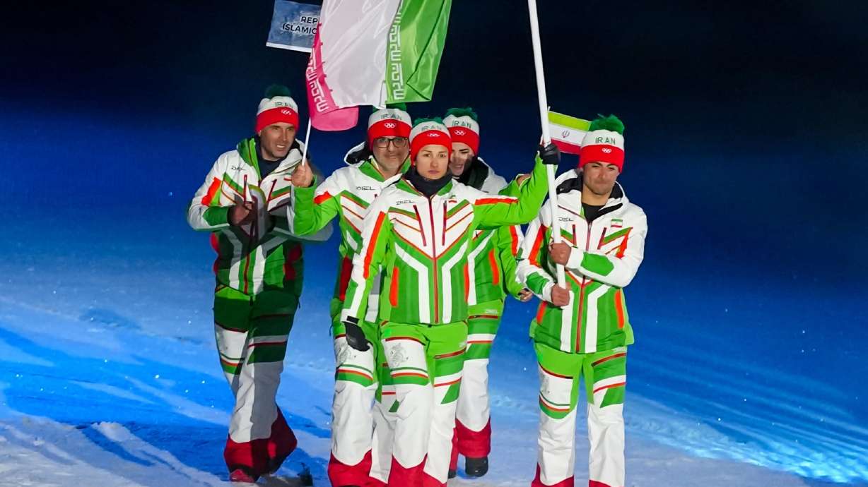 Samaneh Beyrami Baher and Danyal Saveh Shemshaki, the flag bearers of Iran, take part in the athletes' parade during the Olympic opening ceremony at the 2026 Winter Olympics, in Predazzo, Italy, Feb. 6.