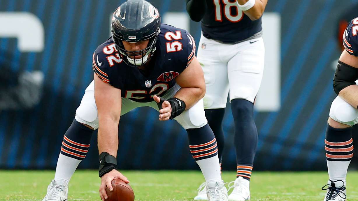 FILE - Chicago Bears center Drew Dalman (52) prepares to snap the ball during the second half of an NFL football game against the Dallas Cowboys, Sunday, Sept. 21, 2025, in Chicago.