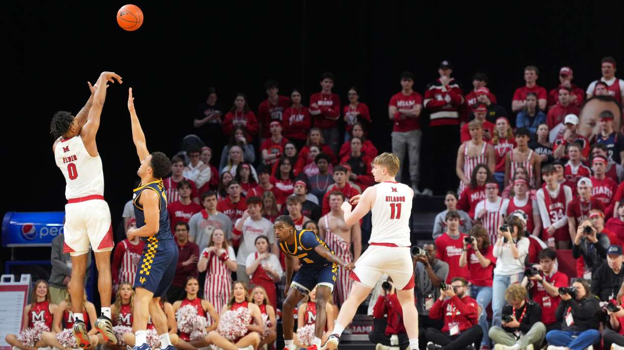Miami's (OH) Eian Elmer, far left, shoots a 3-point basket during the first half of an NCAA college basketball game against Toledo, Tuesday, March 3, 2026, in Oxford, Ohio.