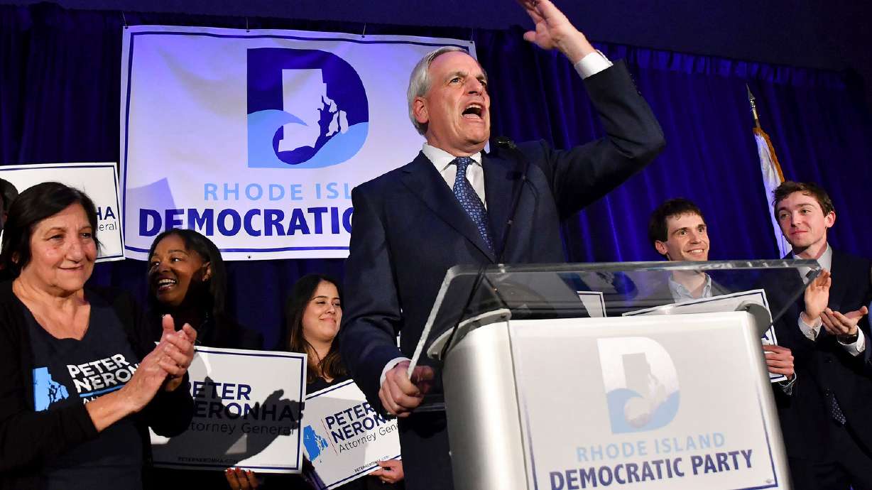 Attorney General Peter Neronha gives a victory speech after winning a second term, during an election-night gathering of Rhode Island Democratic candidates and supporters on Nov. 8, 2022, in Providence, R.I. A new report says Rhode Island Catholic clergy abused hundreds of children for decades, while church leaders minimized the scandal.