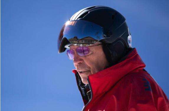 Bob Carlson looks off at a youngster he’s teaching to ski at Kelly Canyon on Friday.