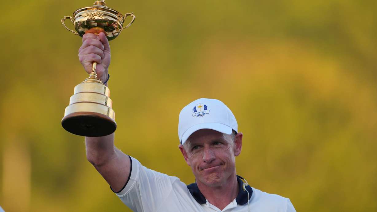 FILE - Europe's captain Luke Donald poses with the trophy after winning the Ryder Cup golf tournament against the United States on the Bethpage Black golf course, Sunday, Sept. 28, 2025, in Farmingdale, N.Y.