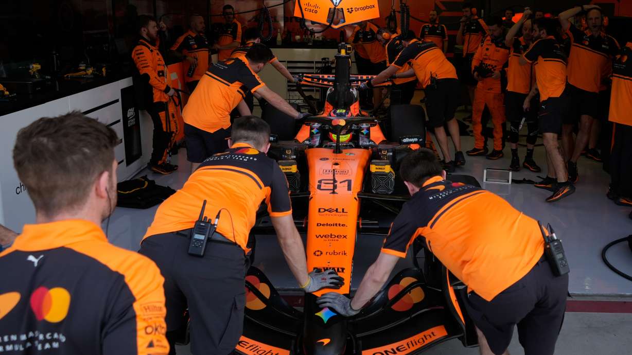 McLaren driver Oscar Piastri of Australia gets pushed back into his garage on the third day of Formula One pre-season test at the Bahrain International Circuit in Sakhir, Bahrain, Friday, Feb. 13, 2026.