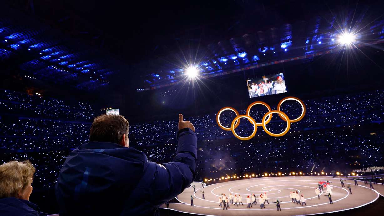 FILE - Kristin Kloster Aasen, former first vice president of Norwegian Olympic and Paralympic Committee, left, and Morten Aasen former Norwegian equestrian athlete wave to the Norway team at the Olympic opening ceremony at the 2026 Winter Olympics, in Milan, Italy, Friday, Feb. 6, 2026.