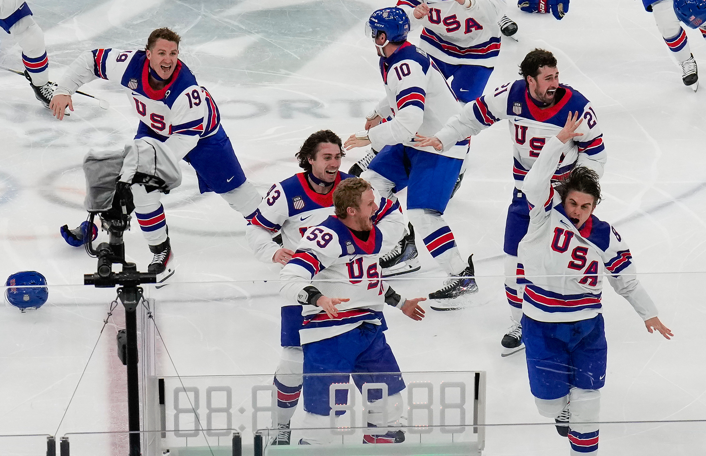The victory lap for America's Olympic hockey champions quietly shed politics from the celebration
