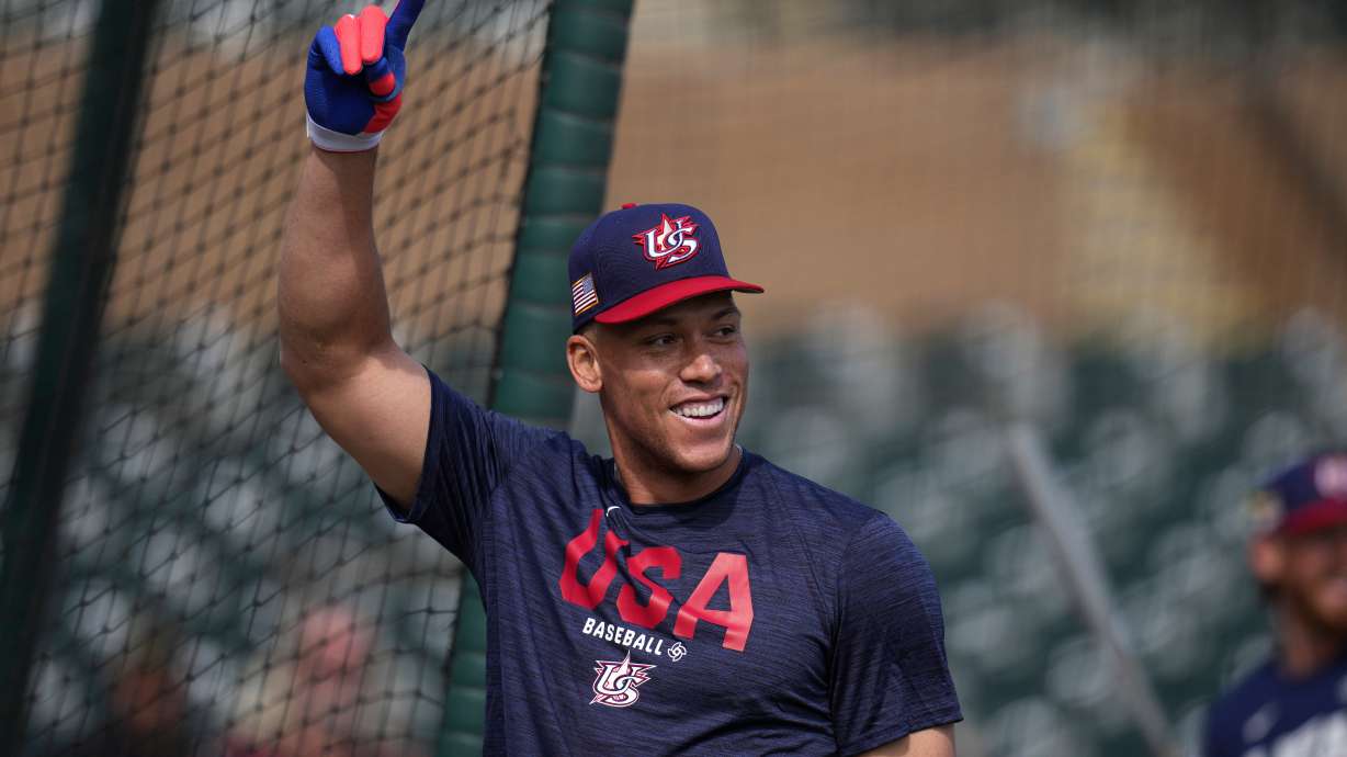United States' Aaron Judge smiles while taking batting practice prior to an exhibition baseball game against the Colorado Rockies Wednesday, March 4, 2026, in Scottsdale, Ariz.