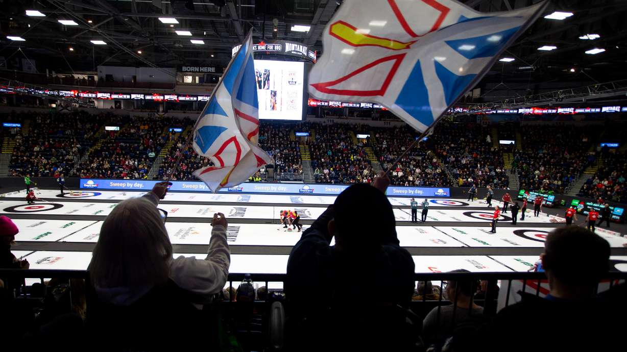 Fans wave Newfoundland and Labrador flags during Draw 5 at the Brier curling event in St. John's, Newfoundland and Labrador, Sunday, March 1, 2026.