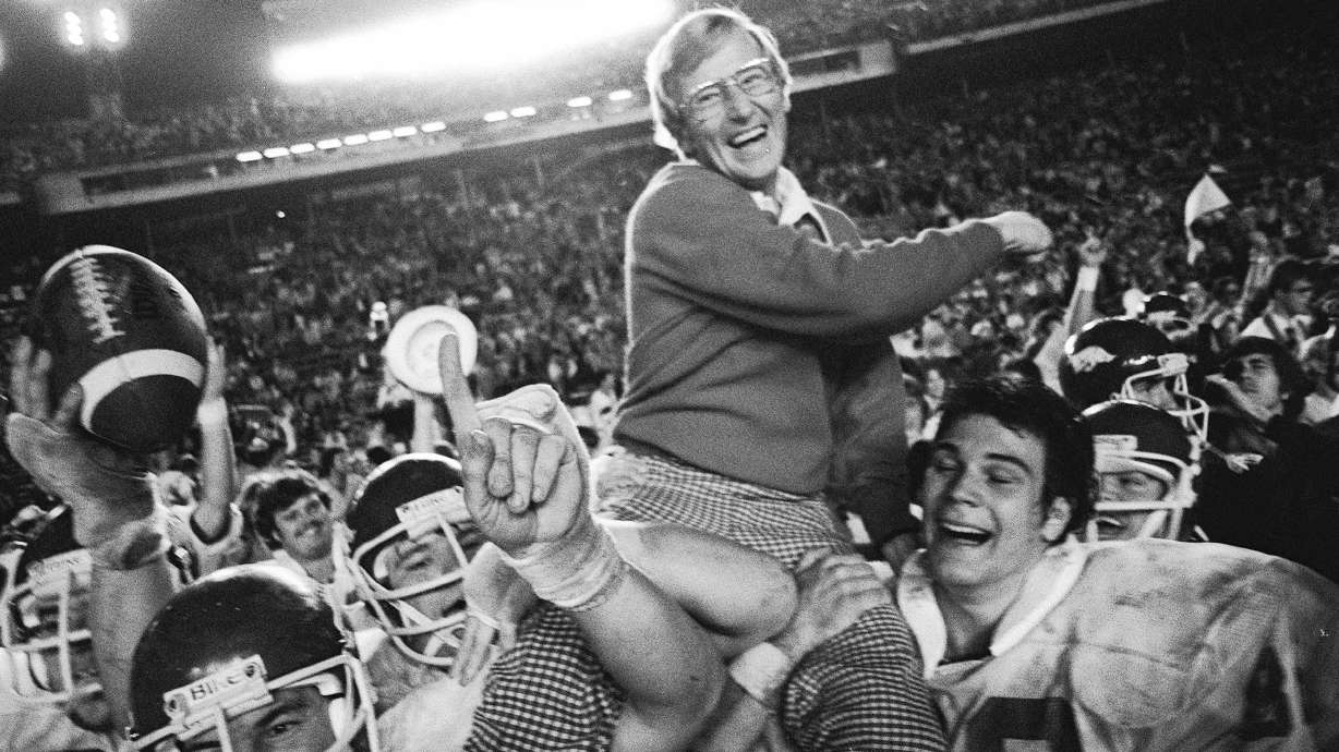 FILE - Arkansas coach Lou Holtz is carried by his players after defeating Oklahoma in the Orange Bowl NCAA college football game, Jan. 2, 1978, in Miami, Fla.