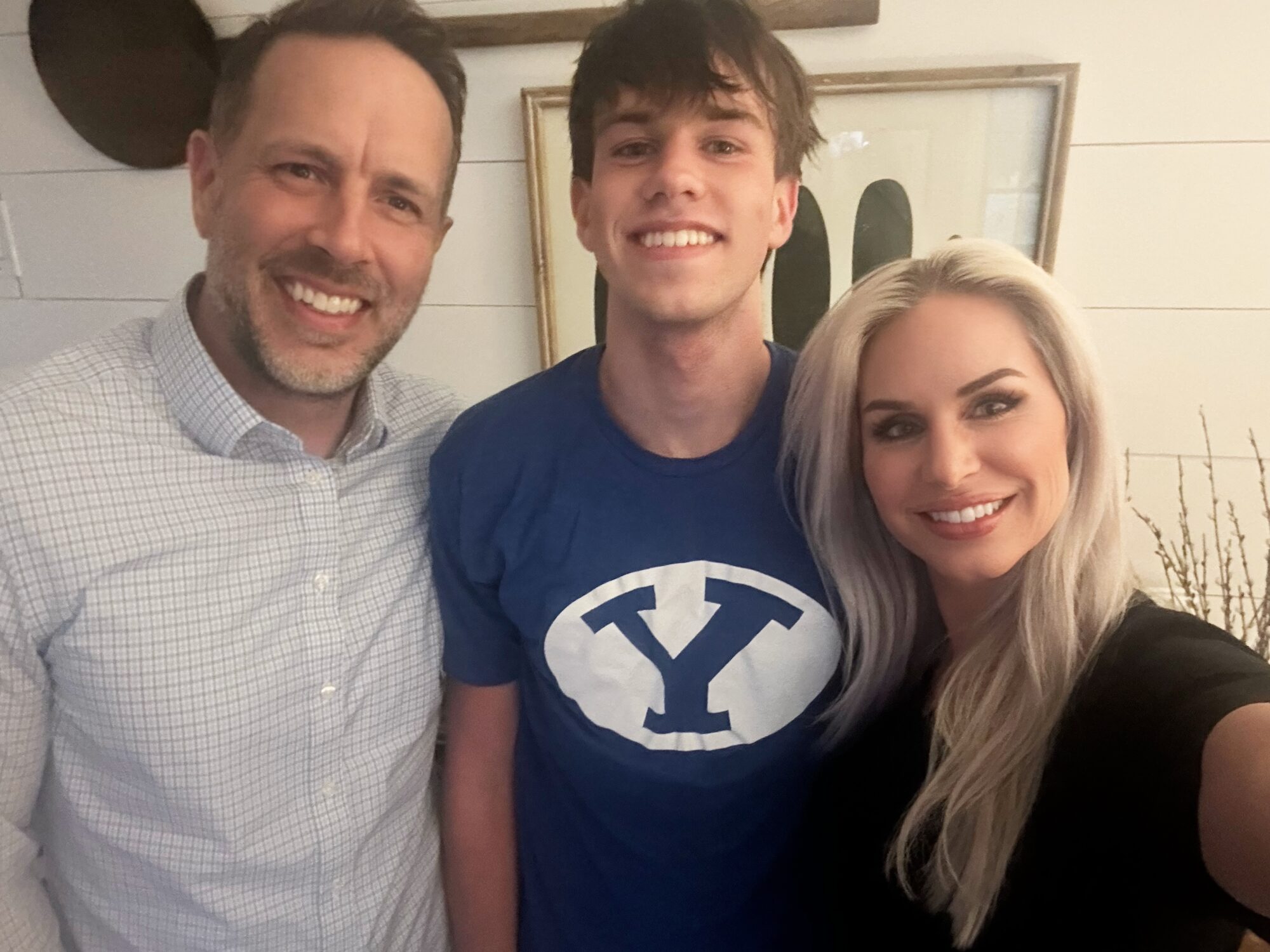 Owen Johansen is pictured with his father, Aaron Johansen, and his mother, Talai Johansen, at their home in Oakton, Va., Wednesday. Owen Johansen was conditionally admitted to Brigham Young University after the school sent out nine mistaken acceptances.