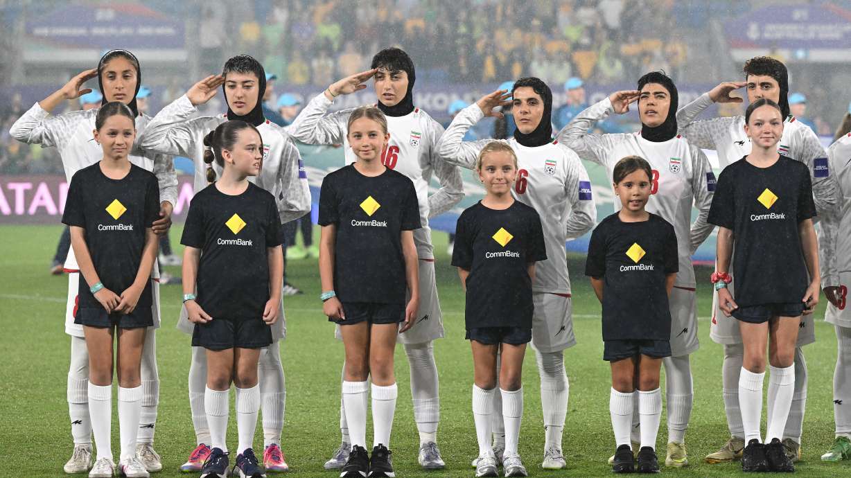Iran players react during their national anthem ahead of the Women's Asia Cup soccer match between Australia and Iran in Robina, Australia, Thursday, March 5, 2026.