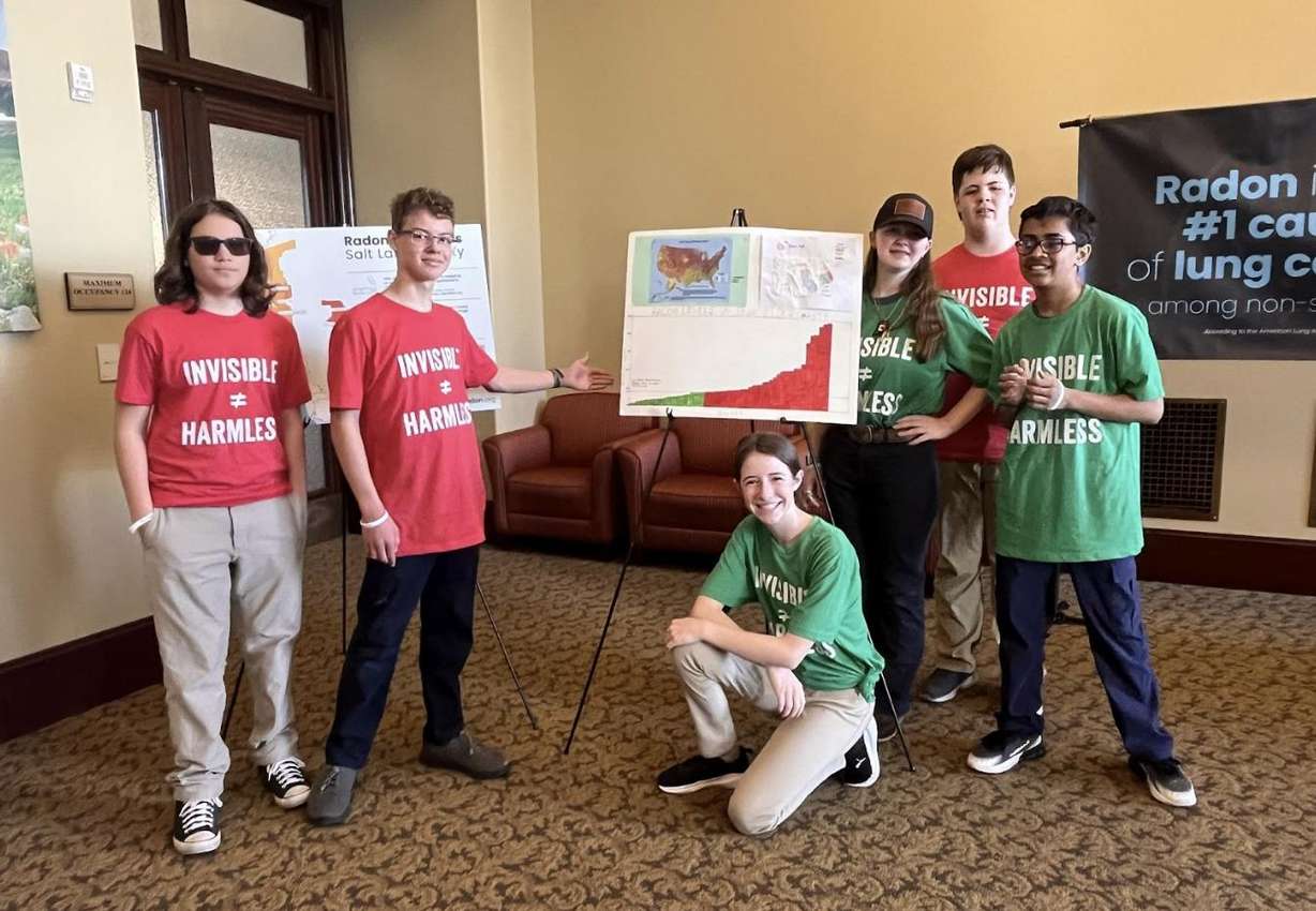 Students from the Promontory School of Expeditionary Learning display their radon test results at the Capitol.