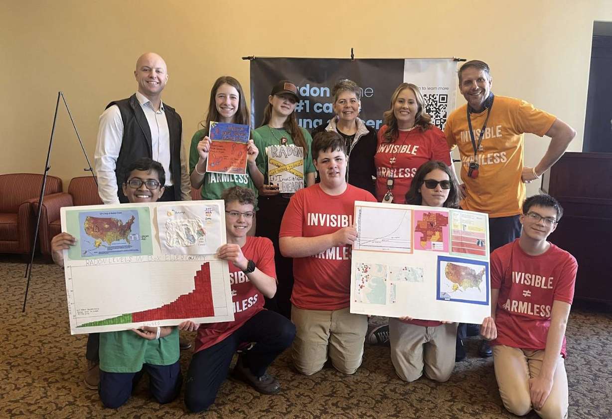 Stage four non-smoking lung cancer survivor Kerri Robbins poses with students and staff from the Promontory School of Expeditionary Learning.
