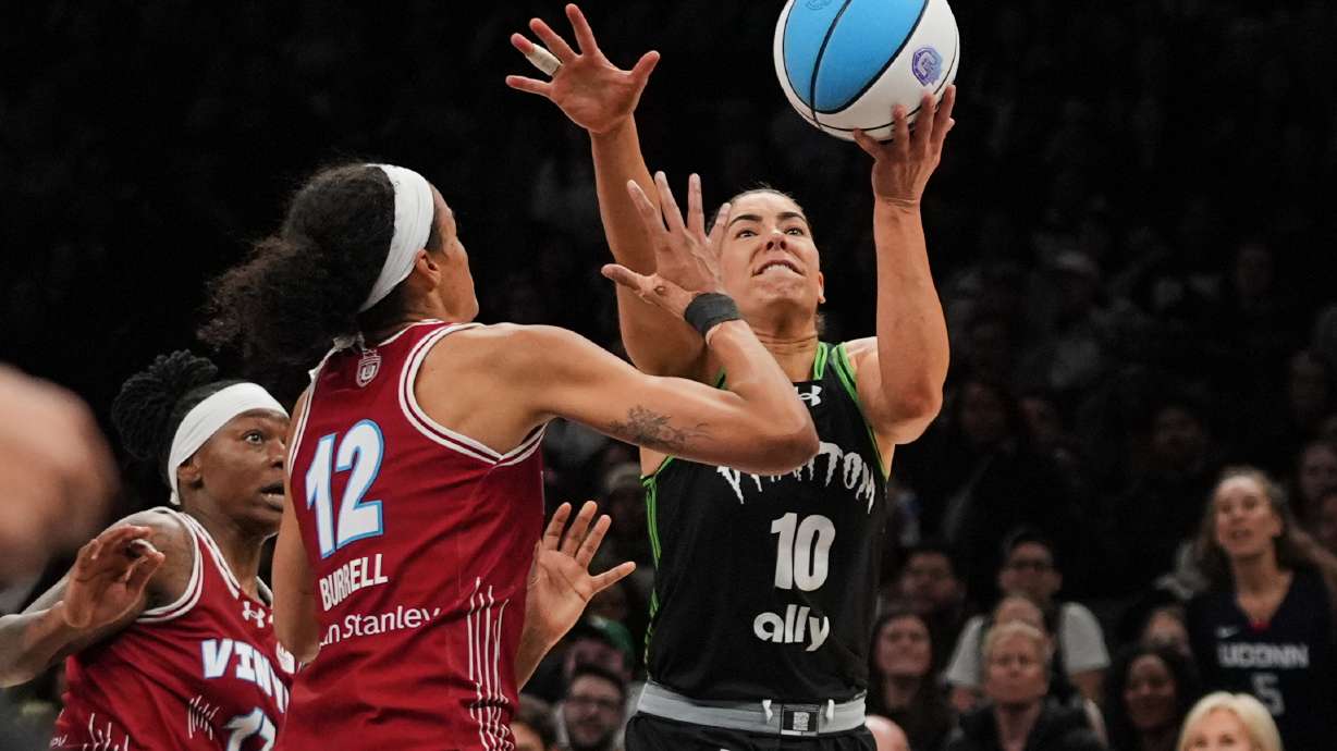 Vinyl BC wing Rae Burrell (12) defends Phantom BC guard Kelsey Plum (10) during the second half of a semifinal in their Unrivaled 3-on-3 basketball game, Monday, March 2, 2026, in New York.