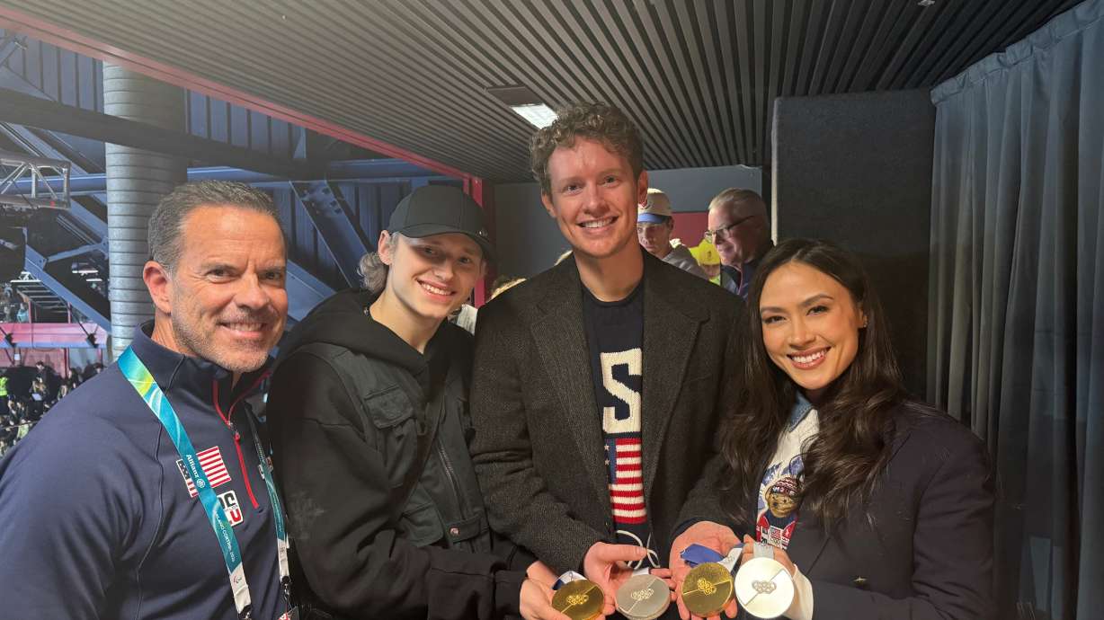 Brad Wilson, CEO of the Organizing Committee for the 2034 Olympic and Paralympic Winter Games, is pictured standing with Team USA skaters Ilia Malinin, Evan Bates and Madison Chock at the Milano Ice Skating Arena on Feb. 16.