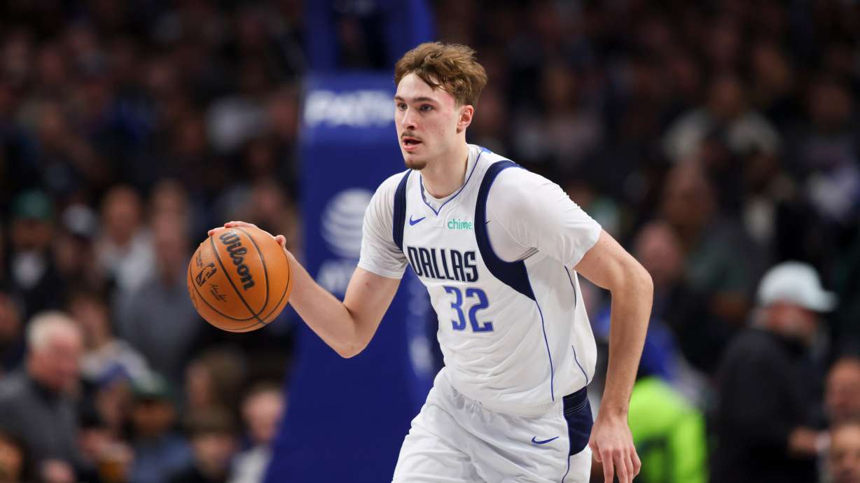 Dallas Mavericks forward Cooper Flagg (32) advances the ball down court in the first half of an NBA basketball game against the San Antonio Spurs Thursday, Feb. 5, 2026, in Dallas.