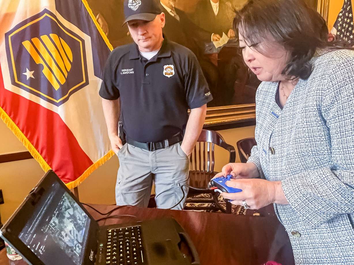 Salt Lake City Police Sgt. Joshua Ashdown demonstrates the department's drone fleet with Utah lawmakers during a celebration of Salt Lake City's 175th birthday at the Utah Capitol on Thursday.