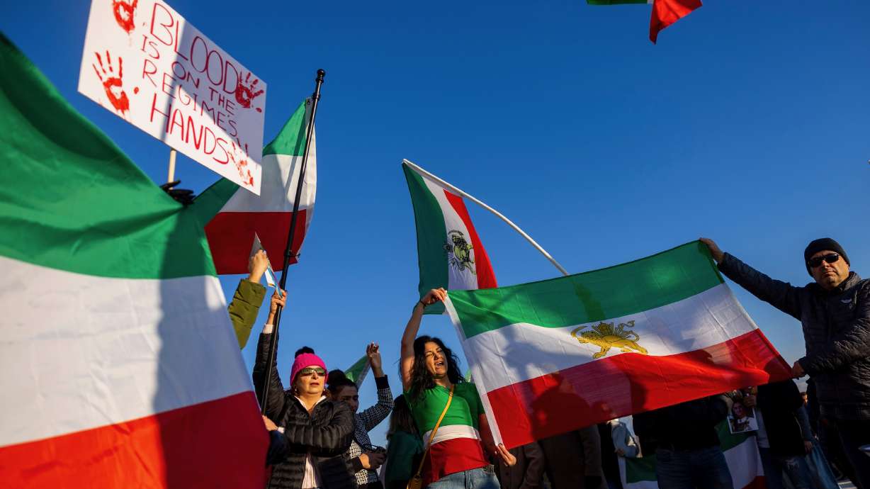 Protesters wave flags during a rally calling for a regime change in Iran at the Capitol in Salt Lake City on Jan. 11. Another demonstration is planned for Saturday at noon at 400 S. State St. in Salt Lake City.