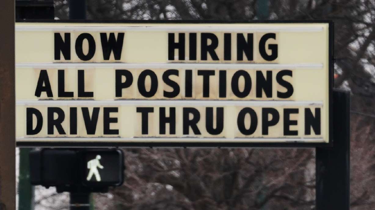 A hiring sign is displayed in front of a restaurant in Chicago, Feb. 5. The U.S. unemployment rate blipped up to 4.4% last month.