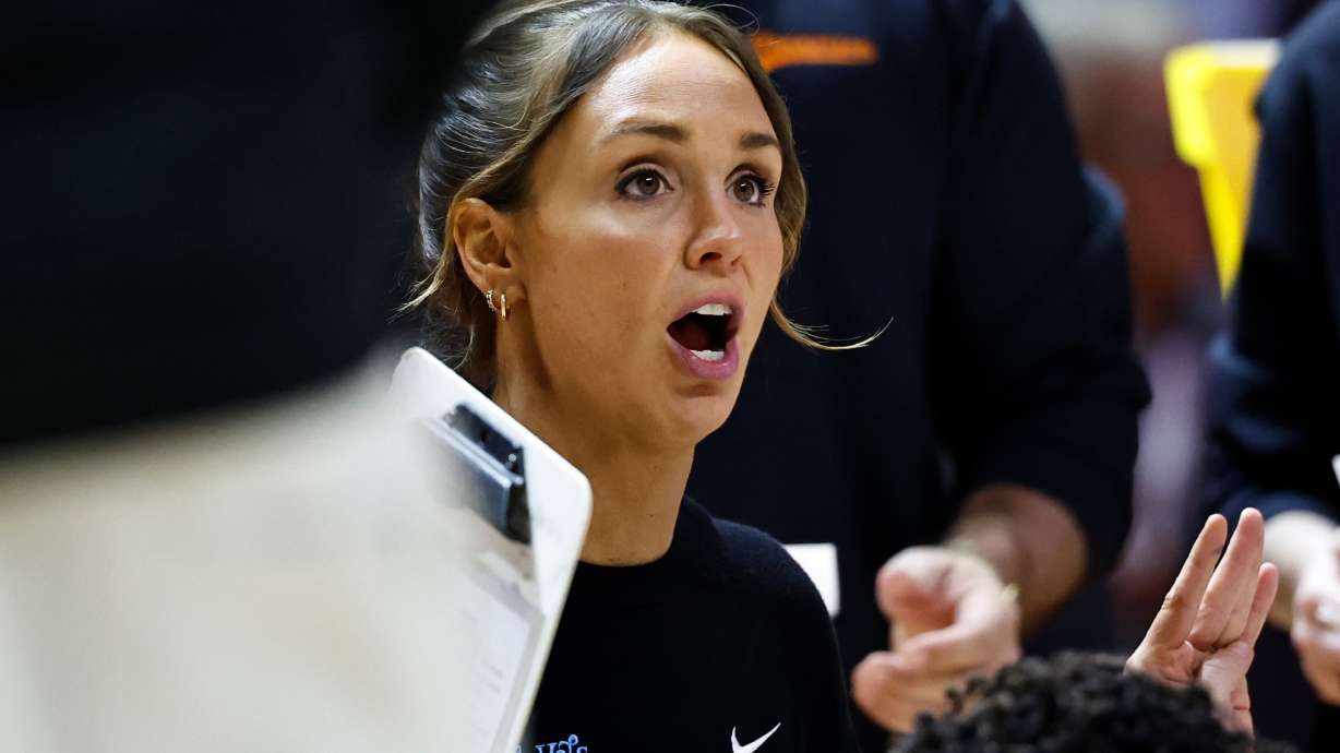 Tennessee head coach Kim Caldwell talks to her players during a timeout in the first half of an NCAA college basketball game against Vanderbilt in Knoxville, Tenn., Sunday, March 1, 2026.