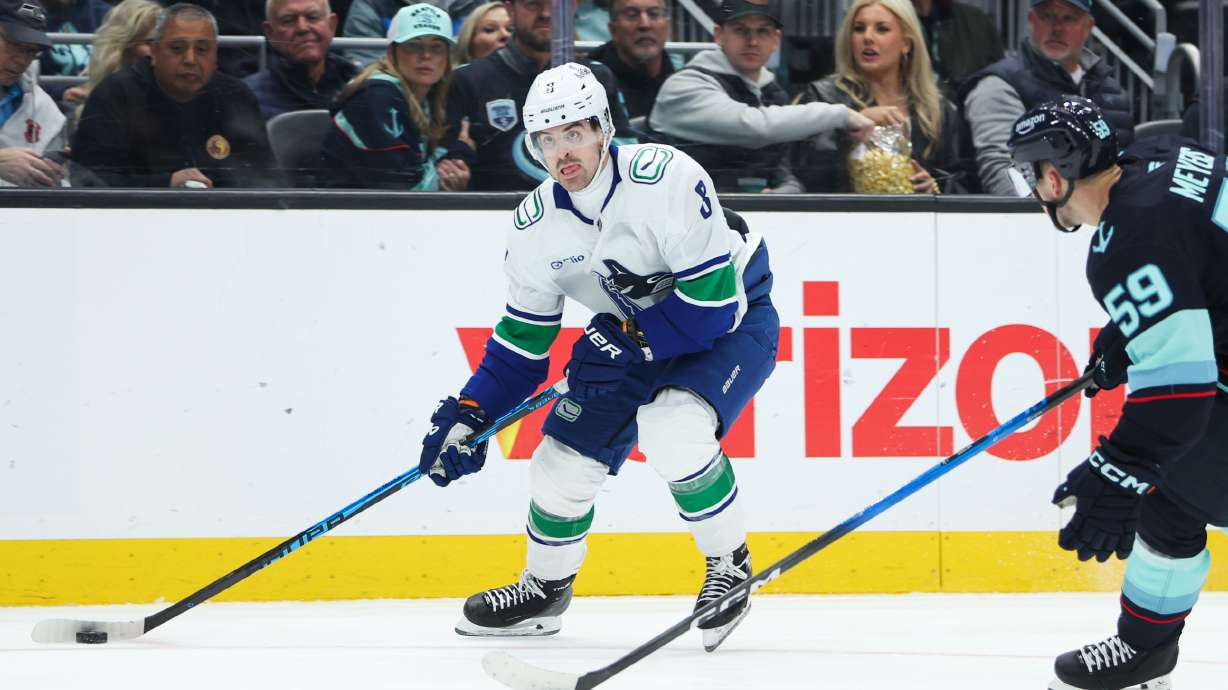 Vancouver Canucks right wing Conor Garland (8) looks to pass in the second period against the Seattle Kraken during an NHL hockey game Saturday, Feb. 28, 2026, in Seattle.