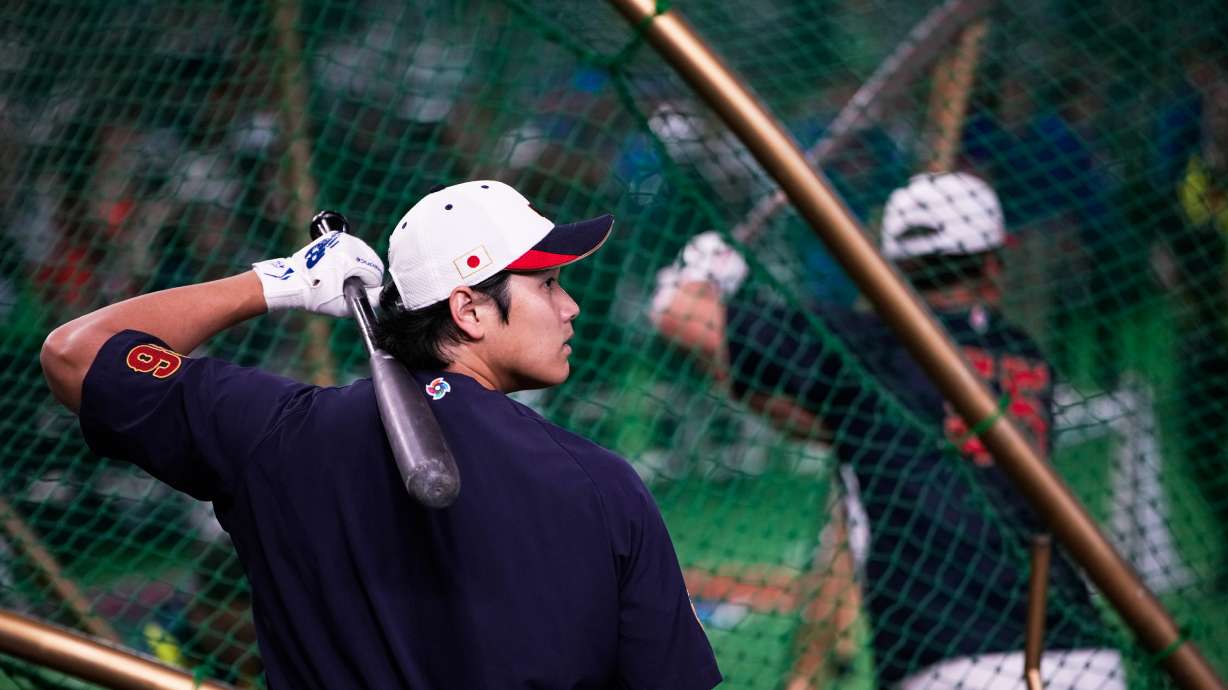 Japan's Shohei Ohtani, left, practices in the nets before the start of a World Baseball Classic Pool C game between Japan and Taiwan Friday, March 6, 2026 in Tokyo.
