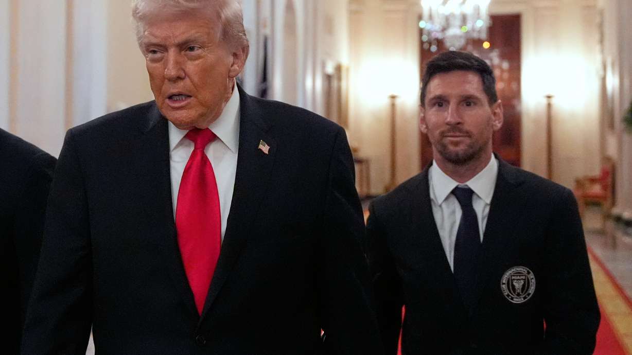Lionel Messi arrives with President Donald Trump at an event to honor the 2025 Major League Soccer champions Inter Miami CF in the East Room of the White House, Thursday, March 5, 2026, in Washington.