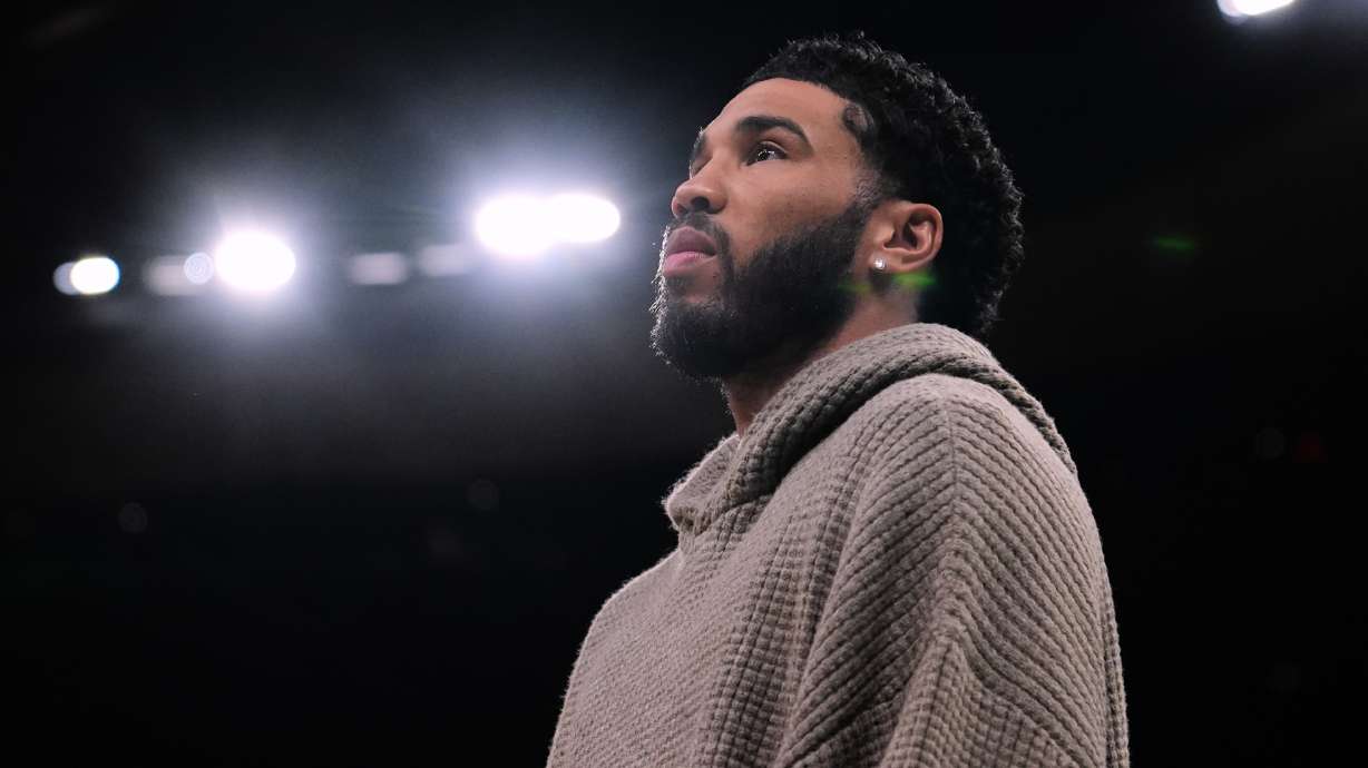 Boston Celtics forward Jayson Tatum stands next to bench during the first half of an NBA basketball game, Wednesday, March 4, 2026, in Boston.