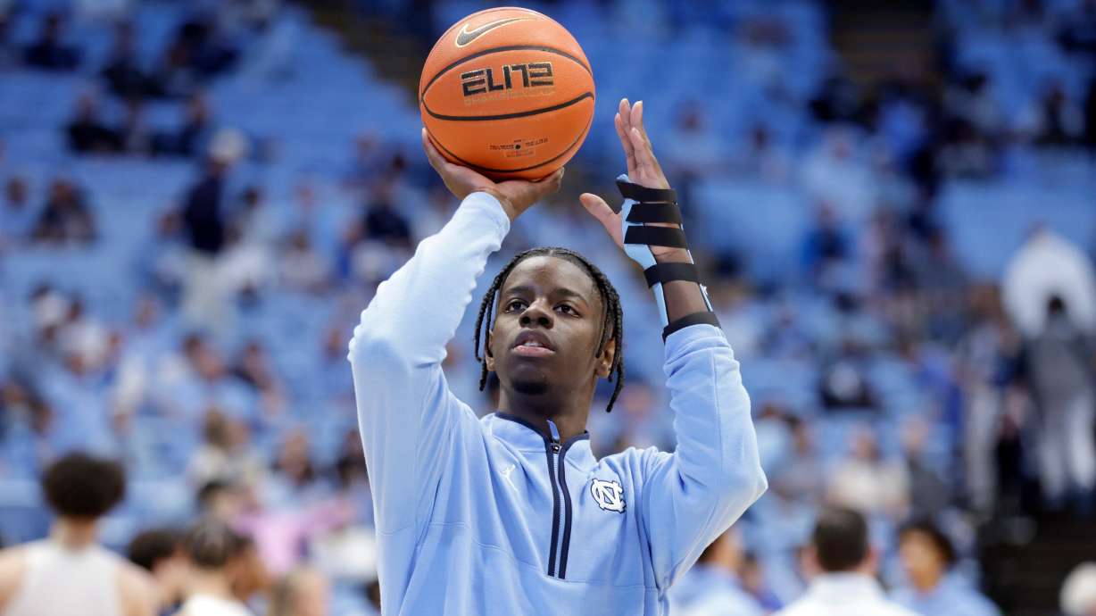 North Carolina forward Caleb Wilson, with his left arm in a medical brace and not playing in the game, shoots during warm-ups before an NCAA college basketball game against Pittsburgh, Saturday, Feb. 14, 2026, in Chapel Hill, N.C.