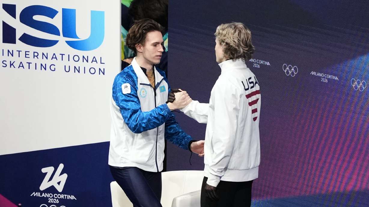 Mikhail Shaidorov reacts to seeing that he took the gold while greeting Ilia Malinin during the men's free skate program at the 2026 Winter Olympics, in Milan, Italy, Feb. 13. Malinin was named the best example of fair play in the Games on Friday.