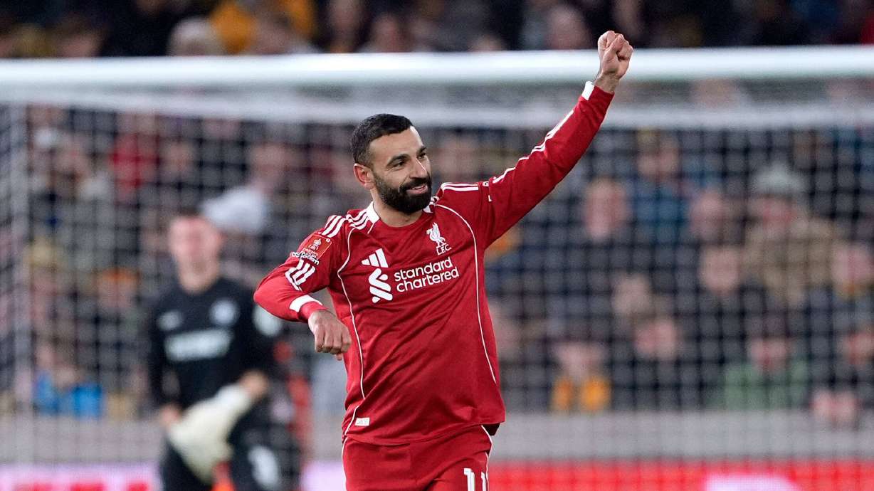 Liverpool's Mohamed Salah celebrates scoring their second goal of the game during an English FA Cup fifth round match against Wolverhampton Wanderers, Friday, March 6, 2026, in Wolverhampton, England.