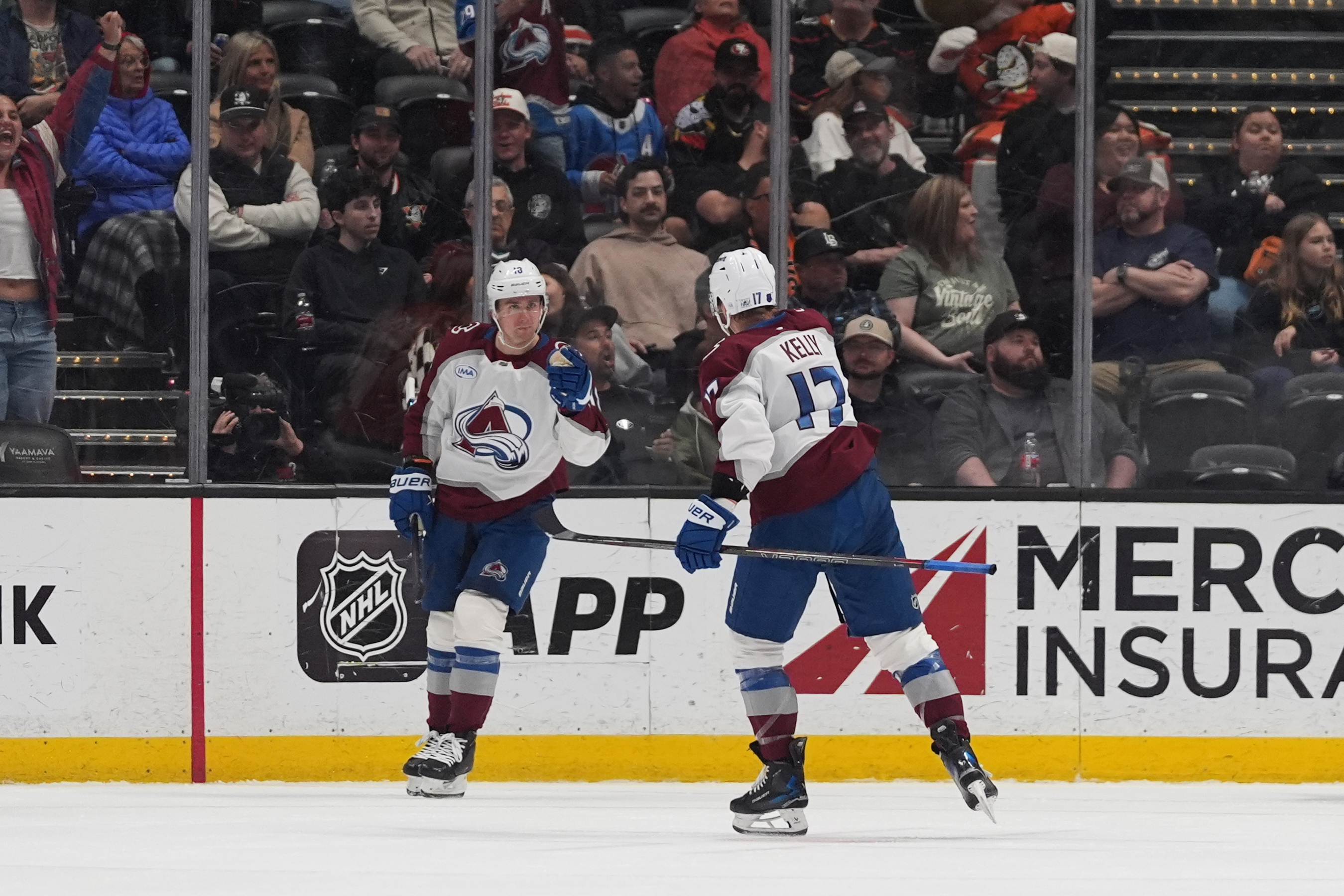 Colorado Avalanche center Parker Kelly (17) celebrates his goal with teammate right wing Valeri Nichushkin during the third period of an NHL hockey game against the Anaheim Ducks Tuesday, March 3, 2026, in Anaheim, Calif.