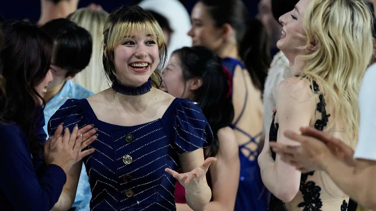 Alysa Liu of the United States, center, reacts with other athletes after performing in the figure skating exhibition at the 2026 Winter Olympics, in Milan, Italy, Saturday, Feb. 21, 2026.