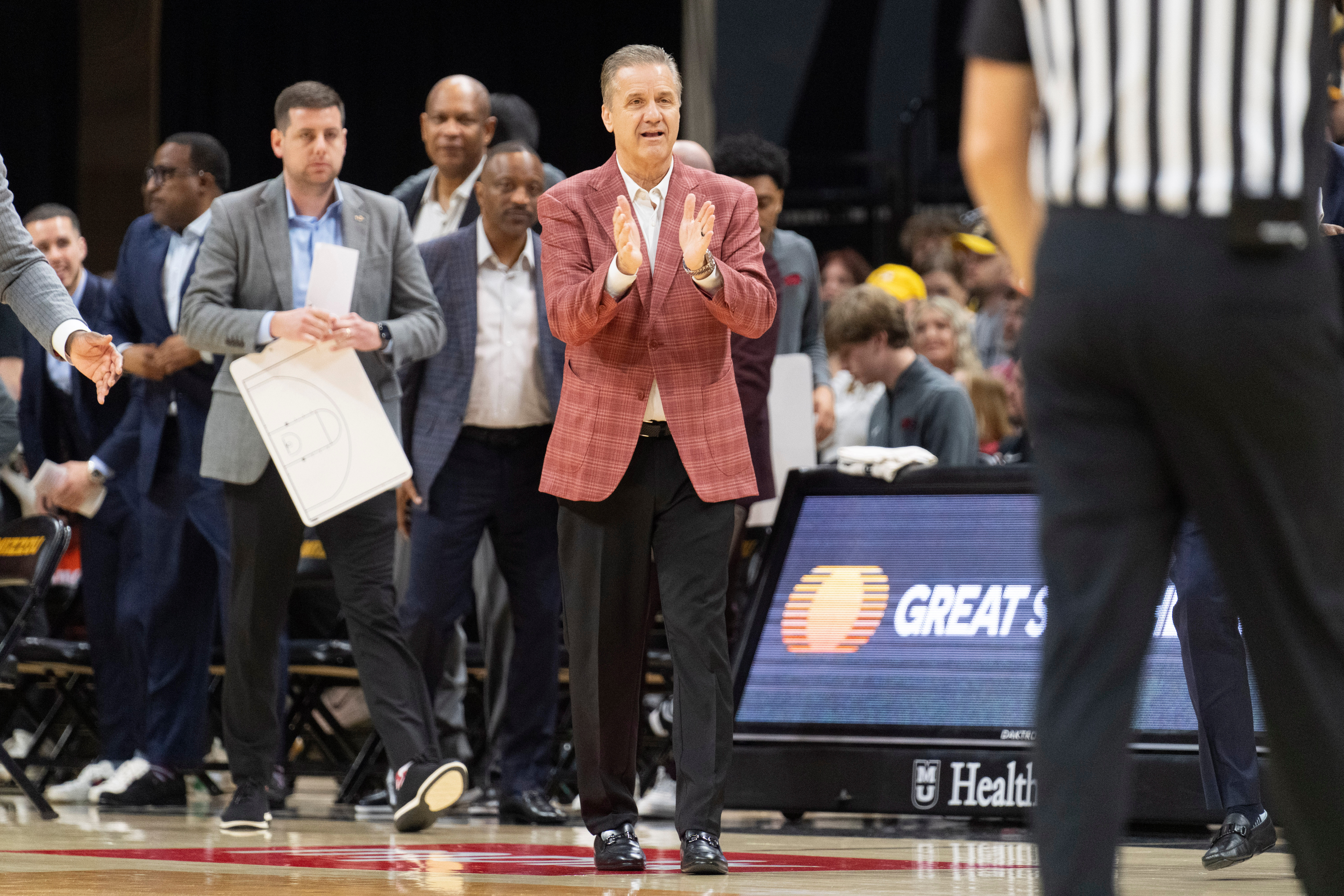 Arkansas head coach John Calipari claps during the first half of an NCAA college basketball game against Missouri Saturday, March 7, 2026, in Columbia, Mo. 