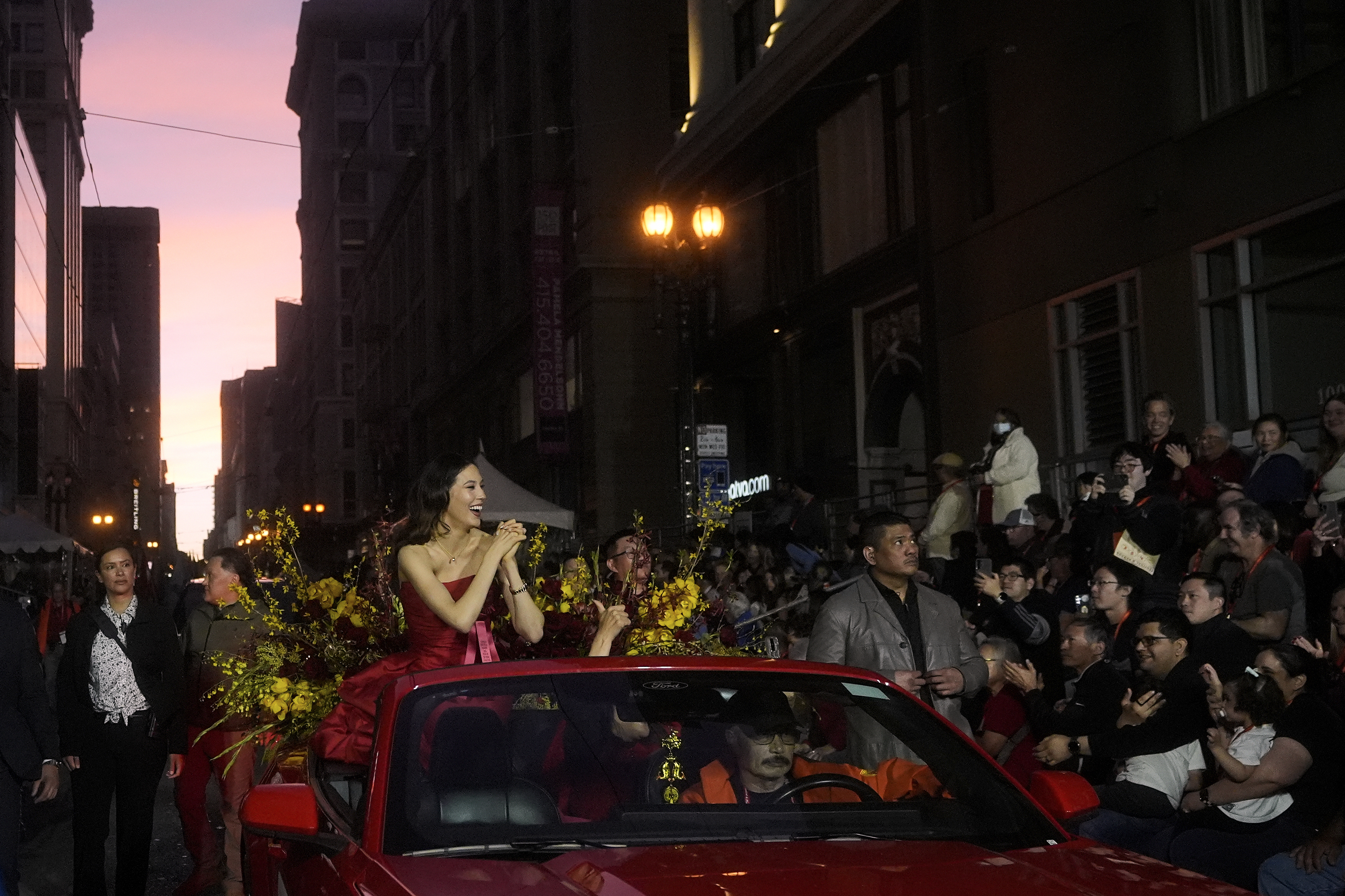 Olympic gold medalist and Grand Marhsal Eileen Gu, middle left, gestures during the Chinese New Year Parade in San Francisco, Saturday, March 7, 2026. 