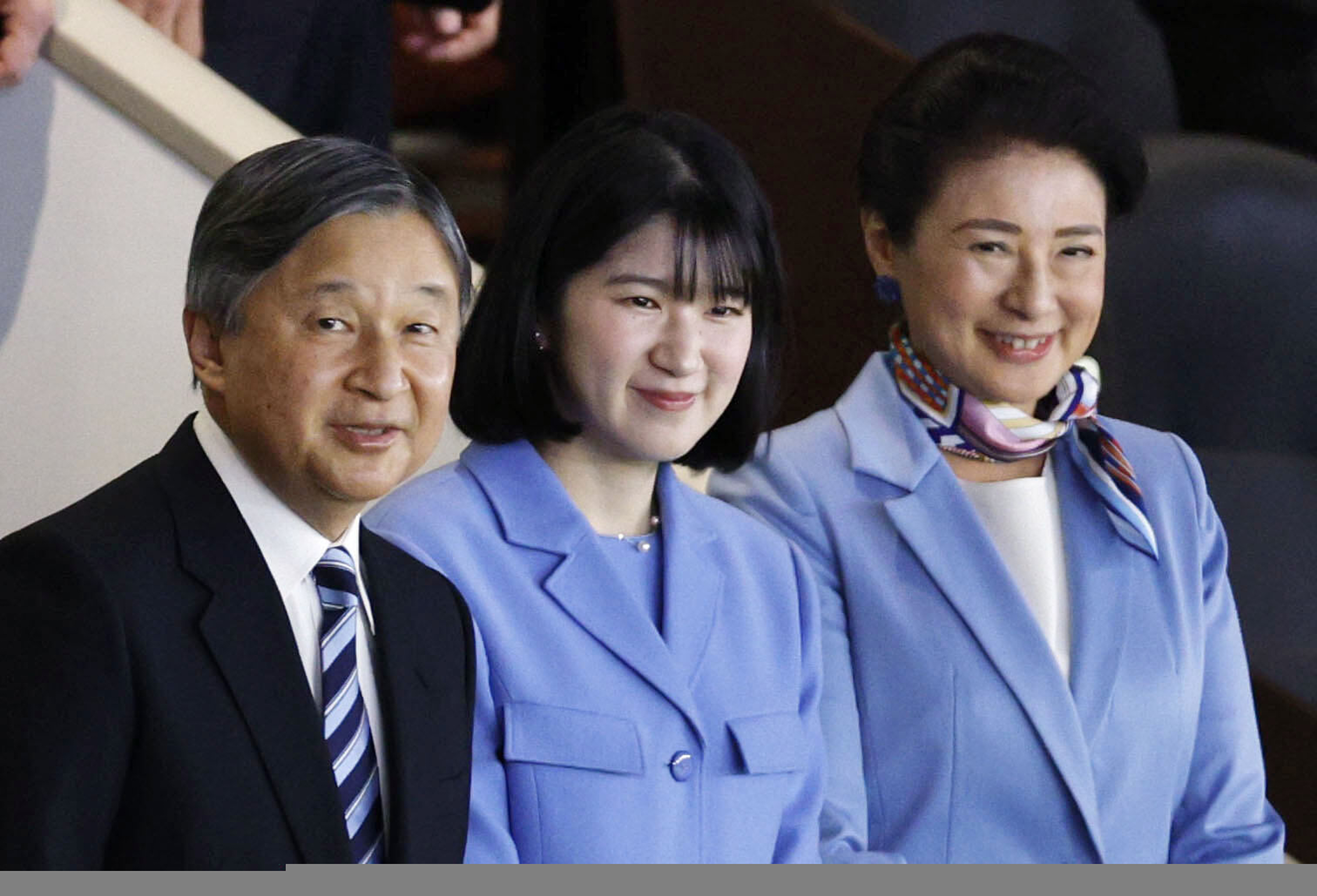 Japan's Emperor Naruhito, Empress Masako, right, and their daughter Princess Aiko watche a World Baseball Classic game between Japan and Australia, in Tokyo Sunday, March 8, 2026. 