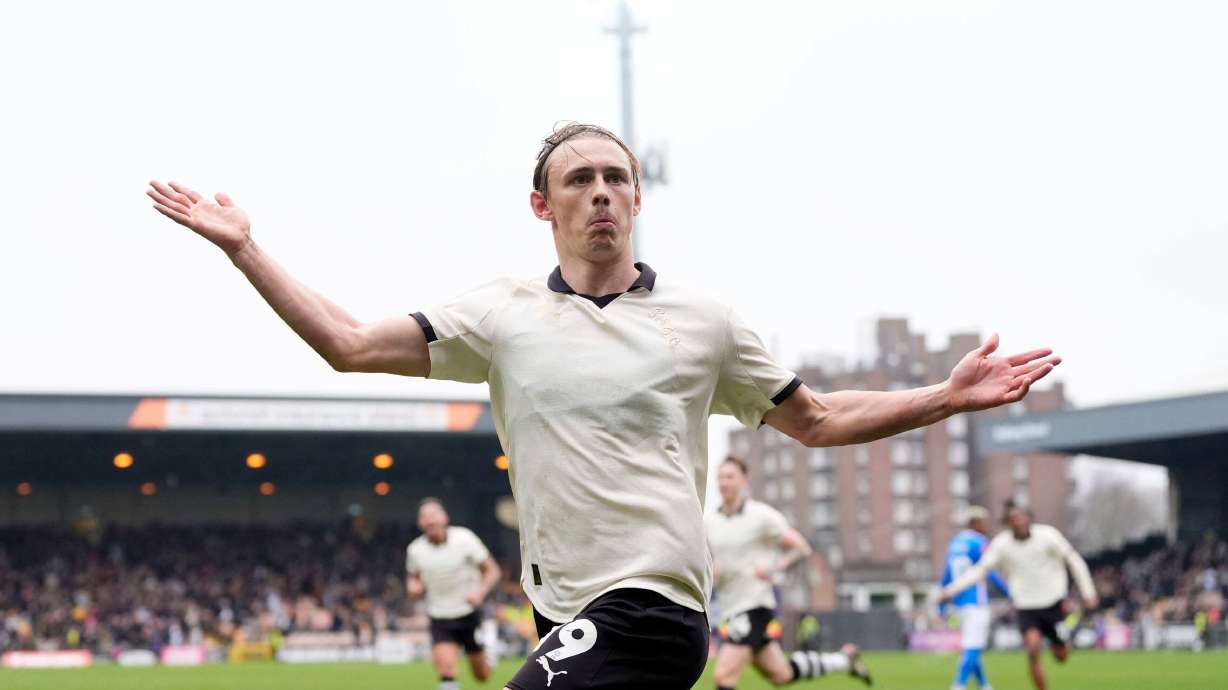 Port Vale's Ben Waine celebrates after scoring his side's first goal of the game during the FA Cup fifth round soccer match between Sunderland and Port Vale, in Stoke on Trent, England, Sunday March 8, 2026.