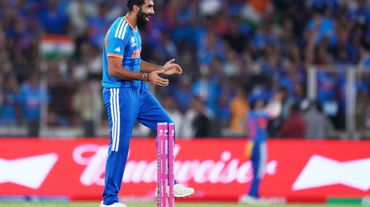 India's Jasprit Bumrah celebrates the wicket of New Zealand's James Neesham during the T20 World Cup cricket final match between India and New Zealand in Ahmedabad, India, Sunday, March 8, 2026.