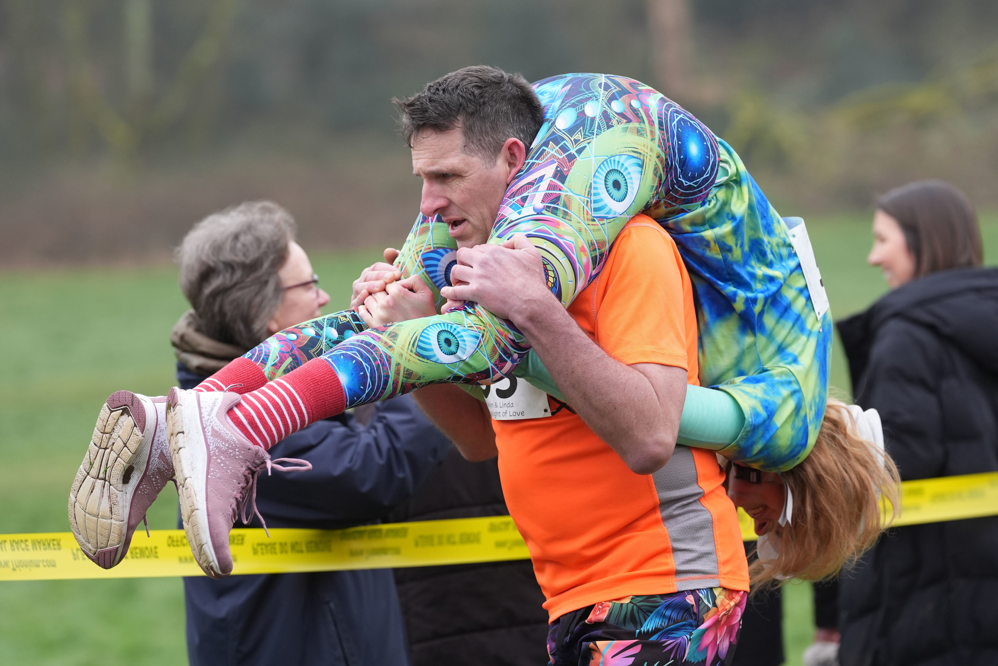 Finnish pair wins a barrel of ale in annual 'wife-carrying' contest in England