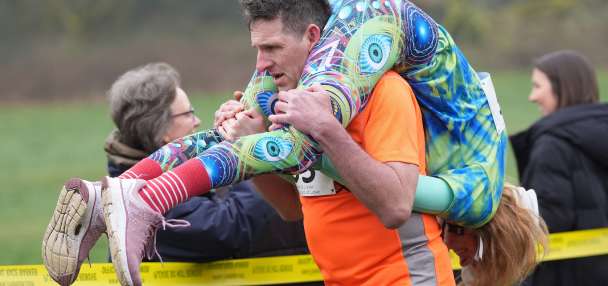 Finnish pair wins a barrel of ale in annual 'wife-carrying' contest in England