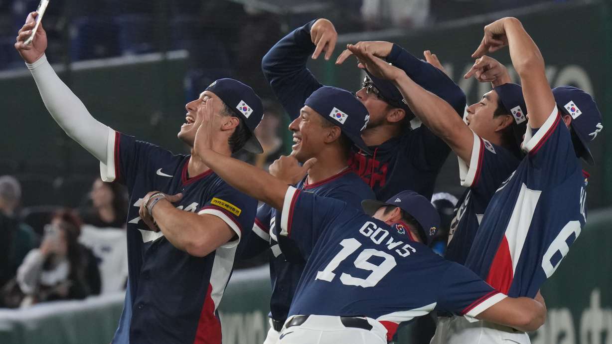 South Korea players take a selfie as they celebrate after defeating Australia in their World Baseball Classic game on Monday, March 9, 2026 in Tokyo.