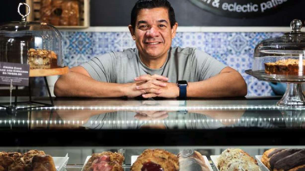 Chef Adalberto Diaz Labrada poses for a portrait at the counter of his bakery, Fillings & Emulsions, in Salt Lake City on Feb. 19, 2025. Since competing on “Holiday Baking Championship” in 2015, he has become a Food Network regular.