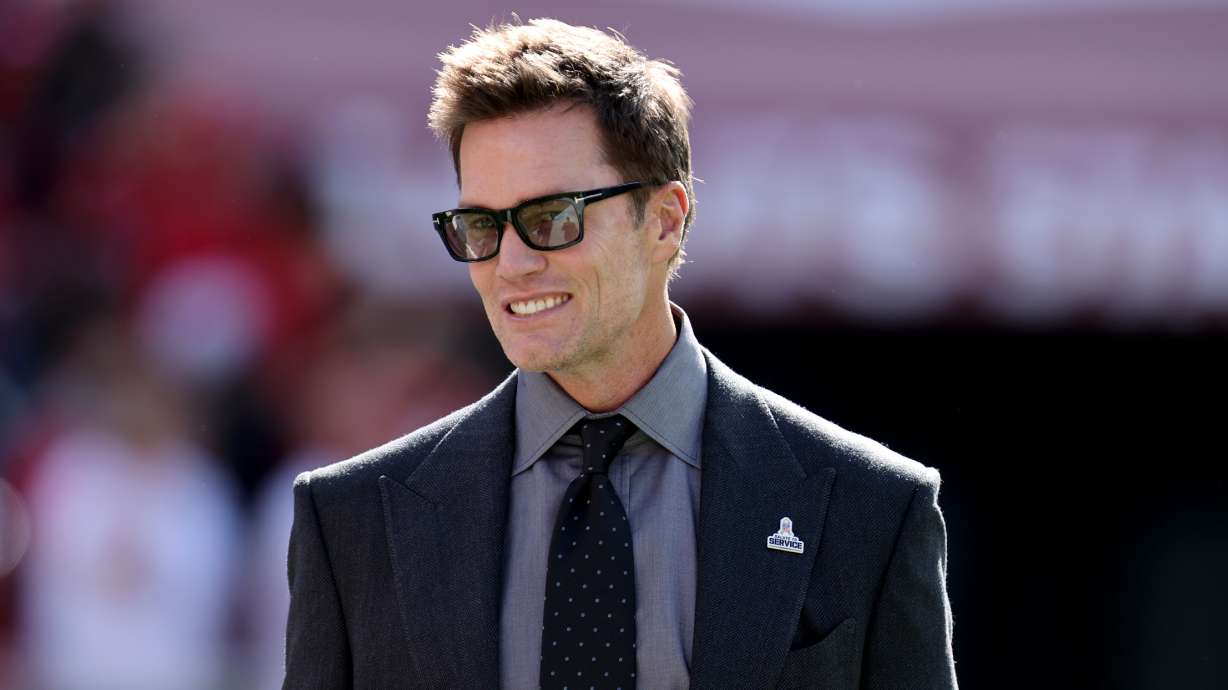 FILE - Tom Brady walks on the field during an NFL football game between the Los Angeles Rams and the San Francisco 49ers, Nov. 9, 2025, in Santa Clara, Calif.